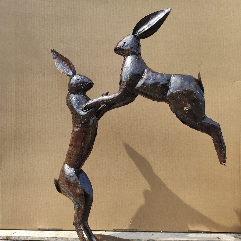 large boxing hares garden sculpture